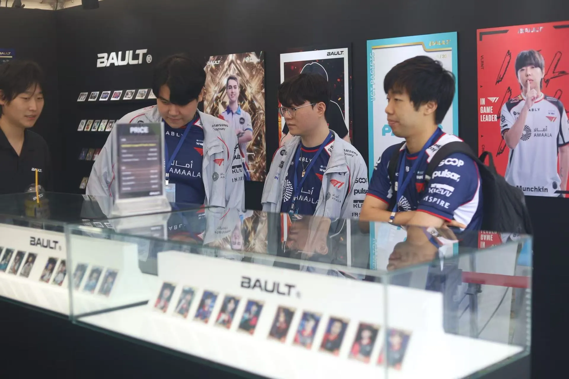 A Bault booth displays VCT Pacific player cards at the Busan finals.