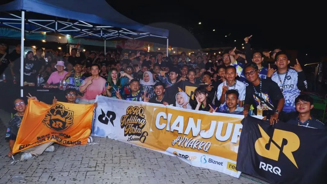 RRQ supporters gather around the club’s banners at a community event.